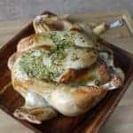 close up Roasted Chicken with Lemon Cilantro in a wood tray