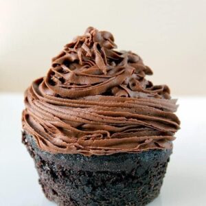 chocolate muffin topped with Chocolate Buttercream Frosting