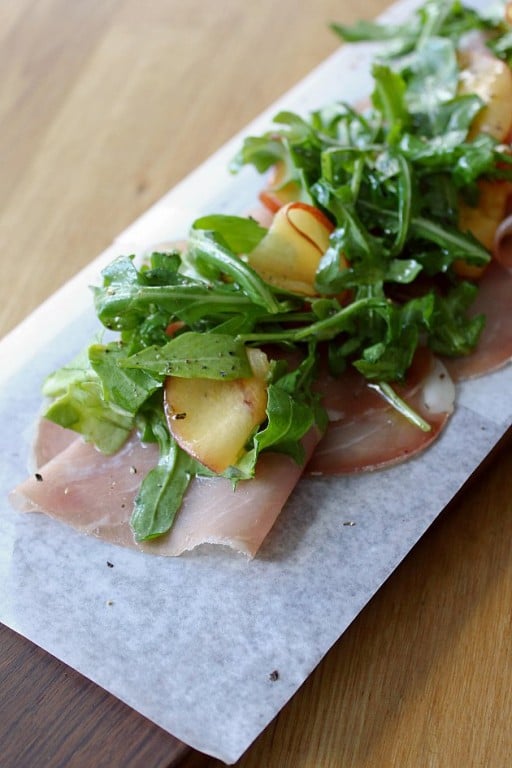 house cured pork loin with shaved nectarines & wild arugula