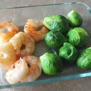 close up of Sweet Thai Shrimp & Brussel Sprouts in a Pyrex baking bowl