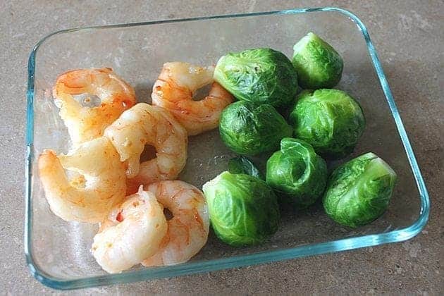 close up of Sweet Thai Shrimp & Brussel Sprouts in a Pyrex baking bowl