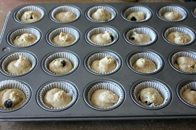 mini muffin tins filled up with muffin batter