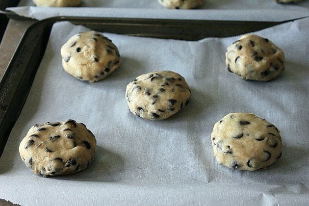 chocolate chip cookie dough balls in a cookie sheet
