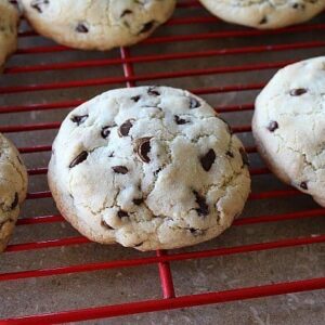 Stuffed Chocolate Chip Cookies in red cooling rack