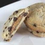 Peanut Butter Cup Stuffed Chocolate Chip Cookie in white background
