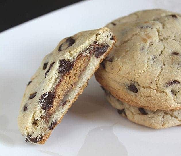 Peanut Butter Cup Stuffed Chocolate Chip Cookie in white background