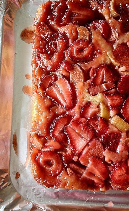 close up of freshly baked Strawberry Rhubarb Upside Down Cake in a pan