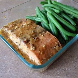 Close up of Salmon & Green Beans in a glass container