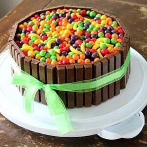 Willy Wonka colorful Cake with KitKat bars and green ribbon