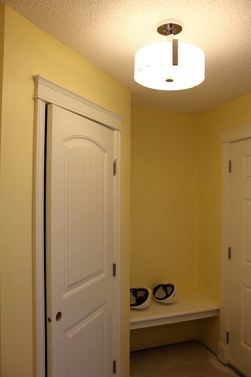 yellow painted walls of the house with white door