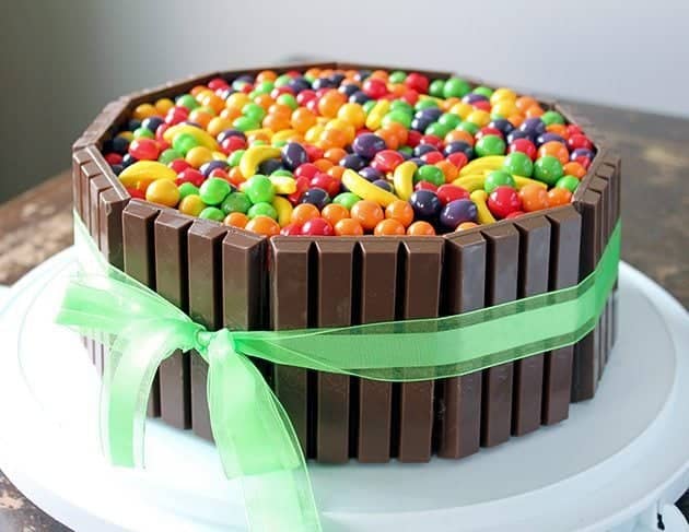 Willy Wonka colorful Birthday Cake with KitKat bars and green ribbon