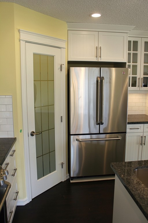 a French door refrigerator in the kitchen corner