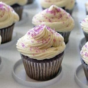 close up of Grape Soda Pop Cupcakes topped with icing and sprinkled with colored sugar