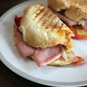 plate with toasted prosciutto sandwiches