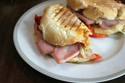white plate with toasted prosciutto sandwiches