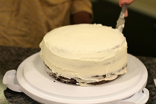 two layers of chocolate cake with vanilla frosting