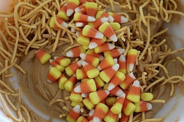 Mixing all together the chow mein noodles, candy corn and melted butterscotch chips