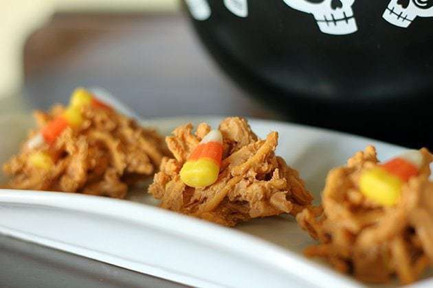 close up hardened Candy Corn Haystacks in white rectangular plate