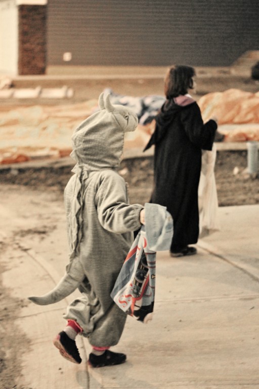  kids walking while wearing halloween costume