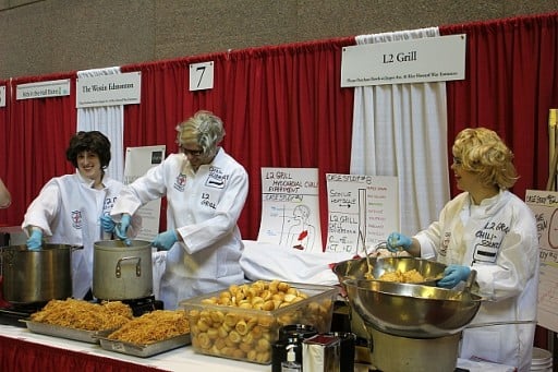 group of three from the L2 Grill team, all wearing white chef uniforms