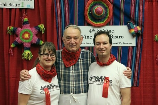 group of three from 4th and vine team, wearing red neck scarfs 