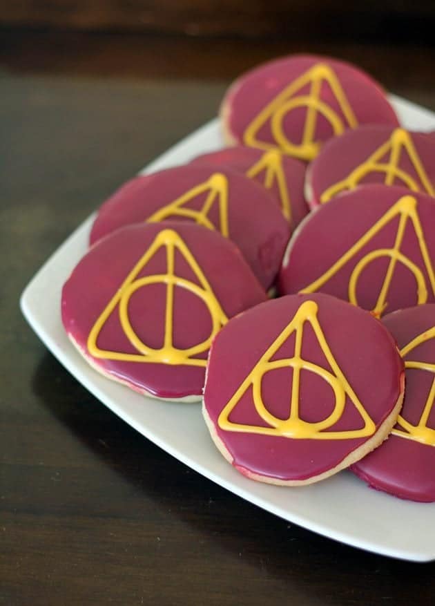 close up pieces of Deathly Hallows Sugar Cookies in white plate