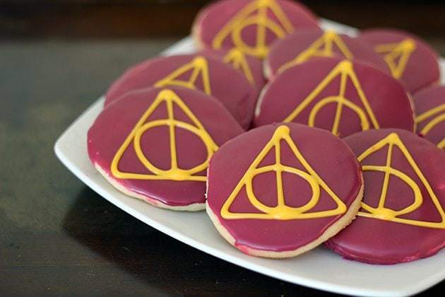 close up pieces of Deathly Hallows Sugar Cookies in white plate