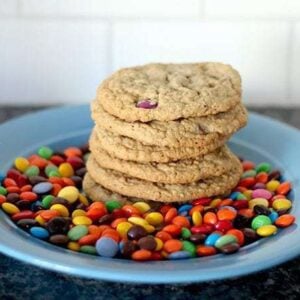 stack of Leftover Cookies in a blue plate with smarties M&M