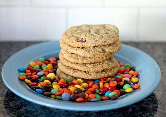 stack of Leftover Cookies in a blue plate with smarties M&M