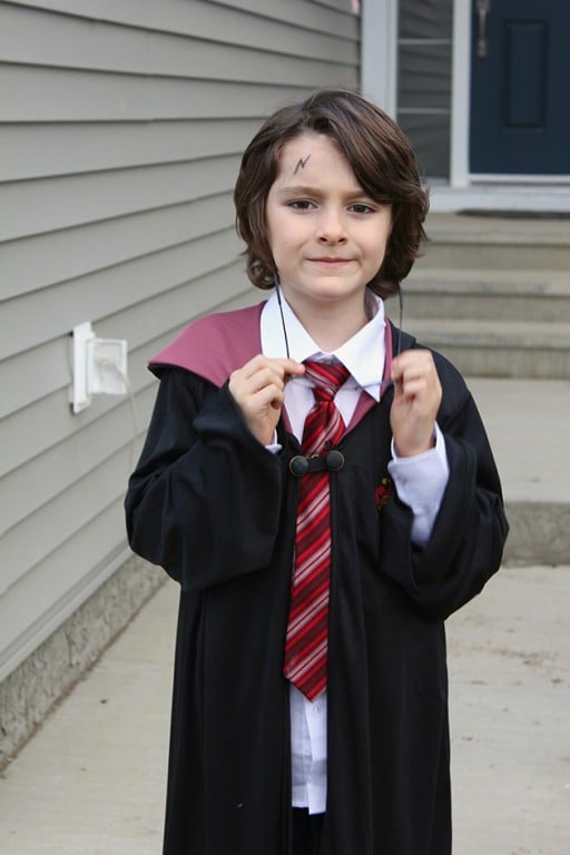 little boy wearing a Harry Potter costume