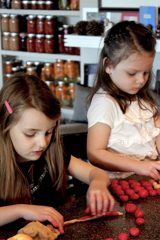 little girls busy doing their baking stuff