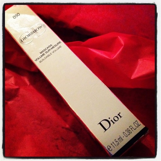 a box of Dior mascara in red background