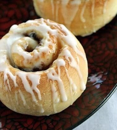 Rum Glazed Mincemeat Cinnamon Buns in red plate
