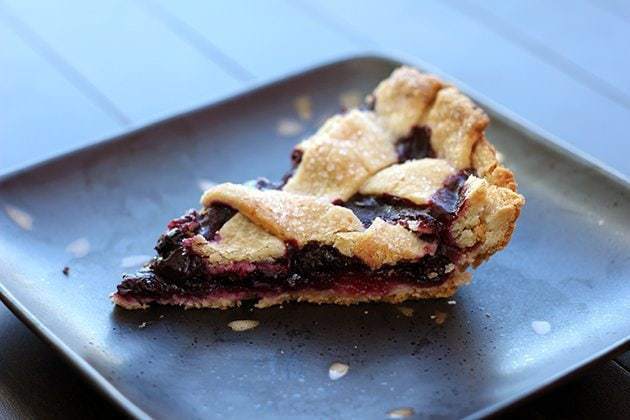 slice of blueberry lemon pie in a black plate