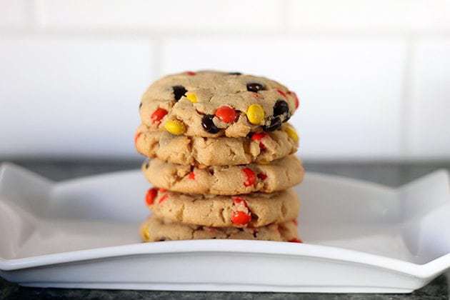 Stack of Reese's Pieces Peanut Butter Cookies in a white plate
