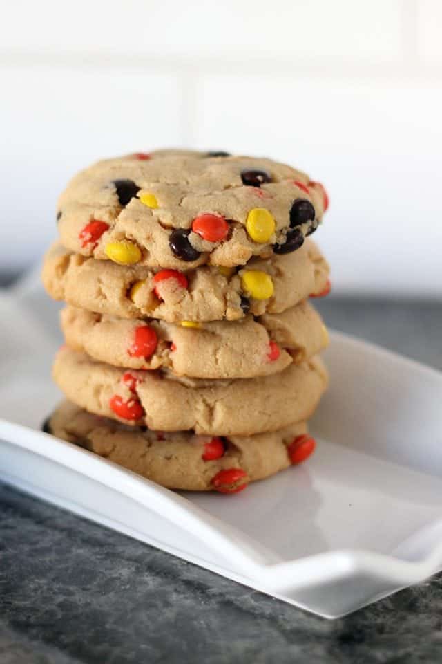 Close up of Stack of Reese's Pieces Peanut Butter Cookies in a white plate