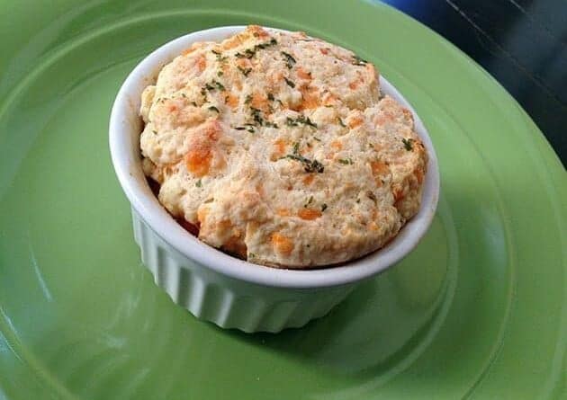 Mini Chicken and Biscuit Pot Pies in White Ramekins on green background