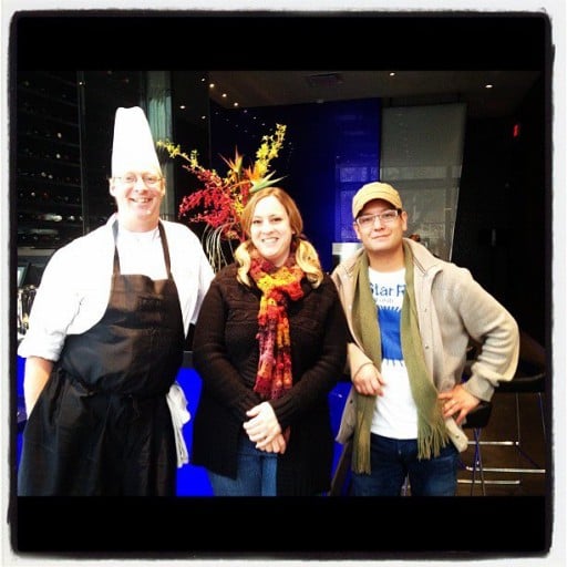 woman in between the two chefs during Culinary Arts Cook Off