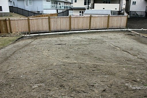 the back yard with lots of vacant spaces