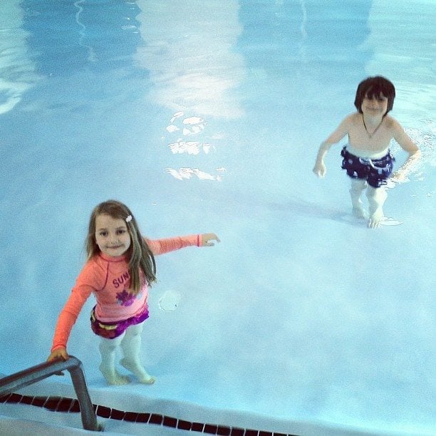 two kids enjoying the pool