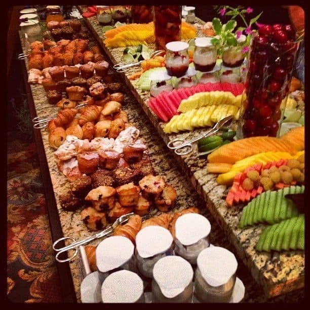 bountiful breakfast set up with fruits, vegetables and muffins