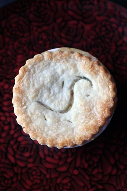 top down shot of Mini Chicken Pot Pies on a red rose designed plate