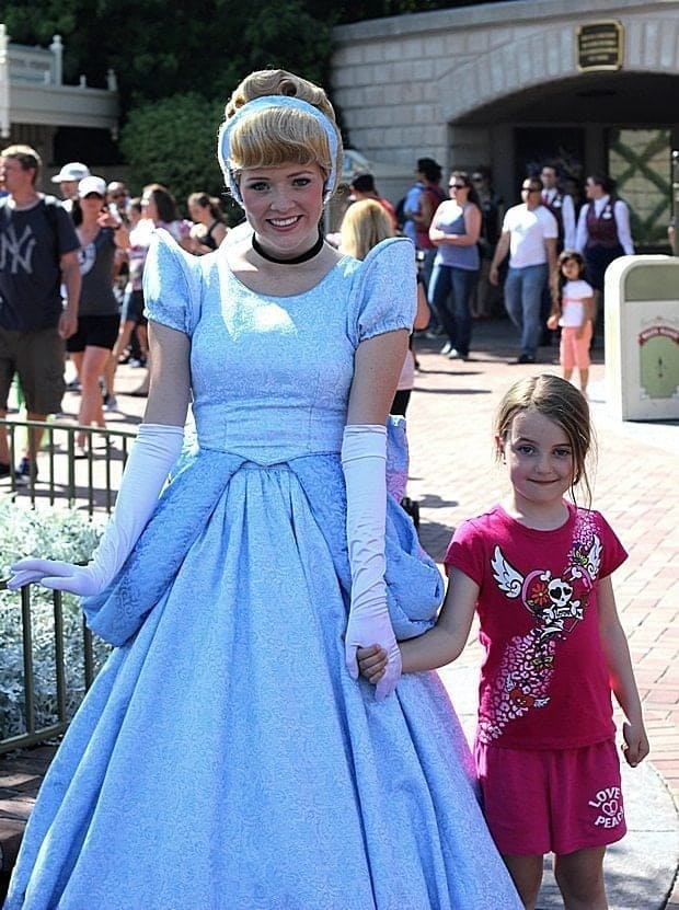 little girl with a Disney Princess in blue dress