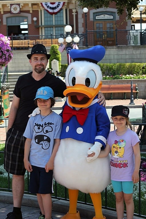 Dad and the kids with Donald Duck character