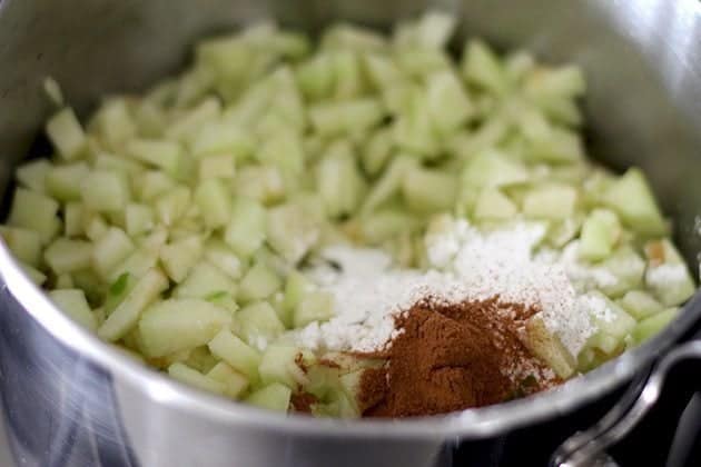 combined ingredients of apple pie filling in a pot