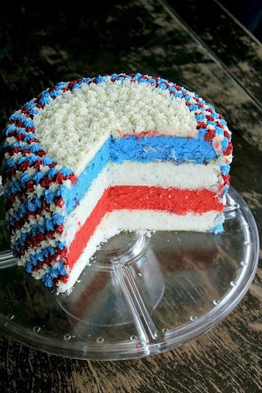 easy fourth of July cake sliced, showing the inner of the cake with red, white and blue color