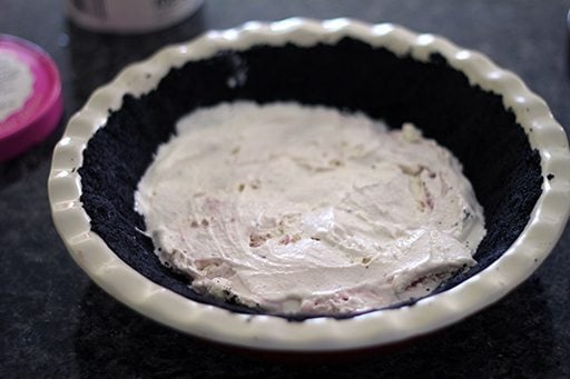 adding the layer of short cakes in pie pan