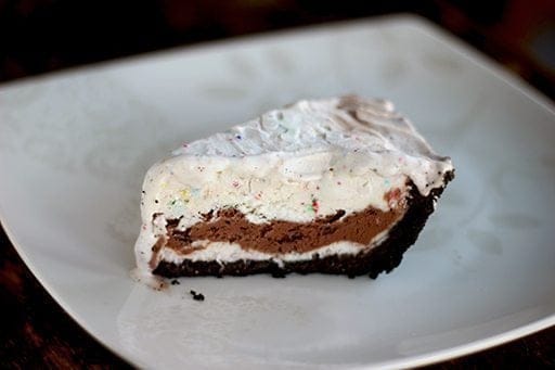 A slice of Easy Ice Cream Pie in a white plate