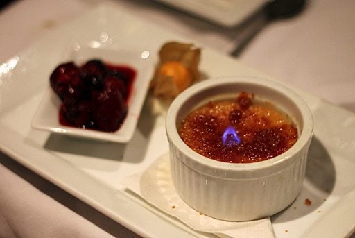 white chocolate torching creme brulee and berries