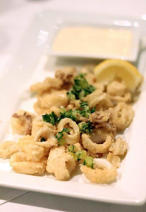 tempura flour crusted calamari served with cucumber gremolata and spicy lemon garlic sauce
